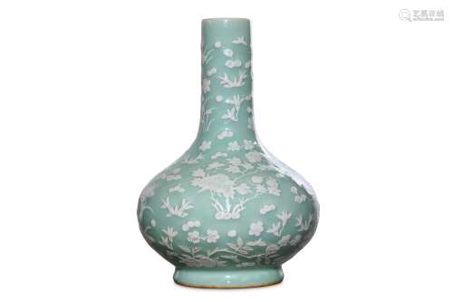 A CHINESE SLIP-DECORATED CELADON VASE. Of pear-sha
