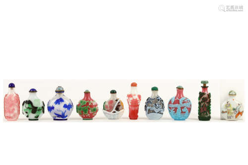NINE CHINESE GLASS OVER GLAZED AND ONE FAMILLE ROSE SNUFF BOTTLES. 19th / 20th Century 7-9cm H. (20)
