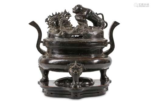 A CHINESE BRONZE ‘DRAGON AND TIGER’ INCENSE BURNER