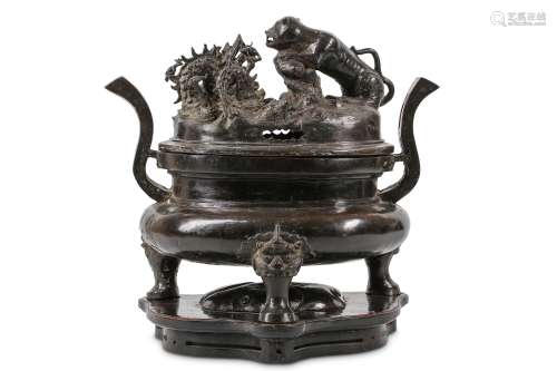 A CHINESE BRONZE ‘DRAGON AND TIGER’ INCENSE BURNER
