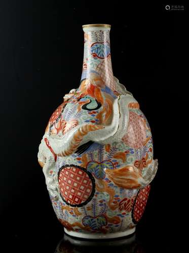 Japanese porcelain bottle vase of lobed form moulded with a dragon and painted with panels of