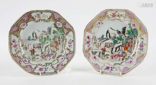 Pair of Chinese Qianlong famille rose plates decorated with figures in an outdoor setting within a