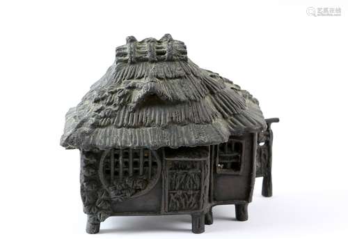 Japanese cast bronze koro and cover in the form of a cottage, signature cartouche to base, 12cm