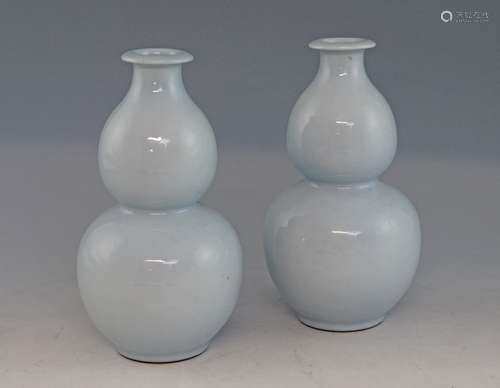 Pair of Chinese pale blue double gourd vases with flared rims, on round feet, blue seal marks to