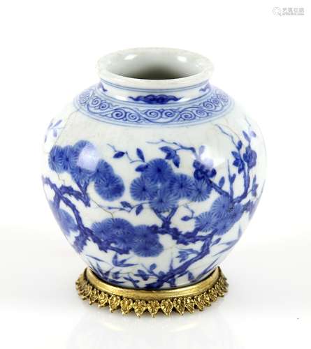 Chinese blue and white vase of ovoid form, decorated with flowers and foliage, on gilt metal