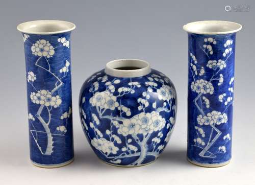 Pair of Chinese blue and white cylindrical vases decorated with flowers and foliage, four