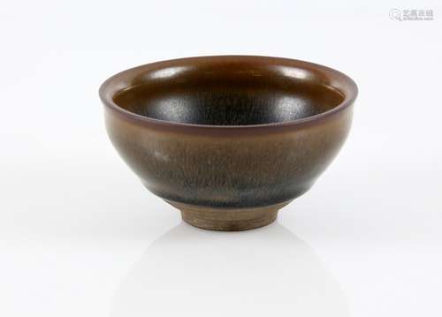 Chinese pottery bowl in a black and brown glaze, on unglazed foot, 9.5cm diameter,