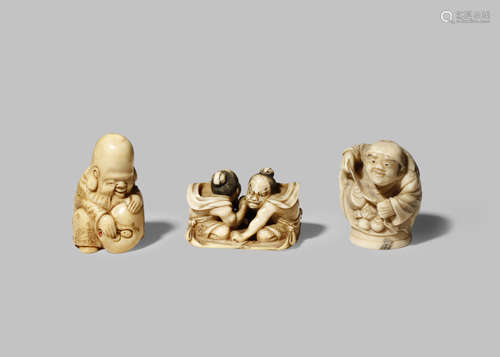 TWO JAPANESE IVORY NETSUKE MEIJI 1868-1912 One carved as the god Fukurokuju holding a large mask