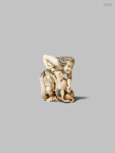 A JAPANESE IVORY NETSUKE MEIJI 1868-1912 Carved as a man slaying a dragon, possibly Susanoo and