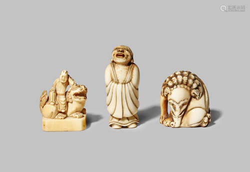 THREE JAPANESE NETSUKE EDO/MEIJI PERIODS Two in ivory, one carved as a seated baku, with a long