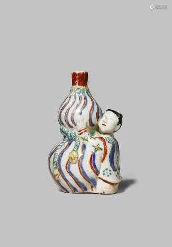 A RARE JAPANESE KAKIEMON FIGURE OF A BOY, KARAKO C.1690 The youth depicted hugging a giant gourd-