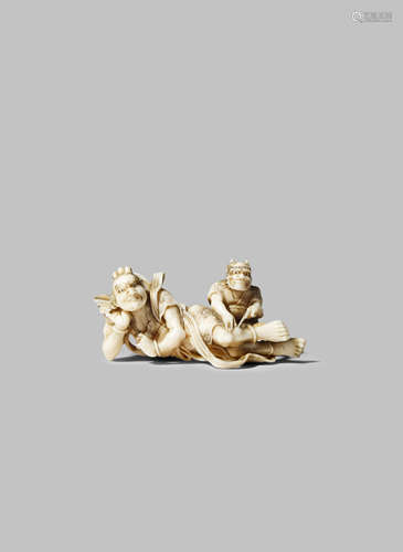 A JAPANESE IVORY NETSUKE MEIJI 1868-1912 Depicting a Nio and an oni, the Buddhist guardian god lying