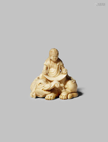 A JAPANESE IVORY NETSUKE MEIJI 1868-1912 Finely carved as Monju Bosatsu seating on a reclining