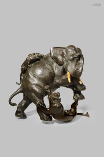 A LARGE JAPANESE BRONZE MODEL OF AN ELEPHANT, OKIMONO MEIJI 1868-1912 The pachyderm fending off