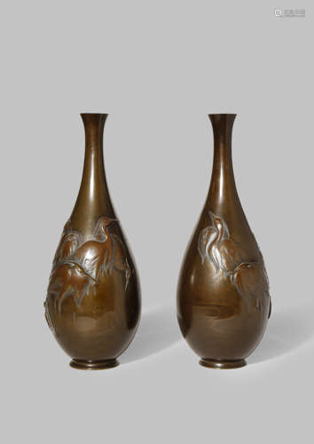 A PAIR OF JAPANESE BRONZE VASES MEIJI 1868-1912 The tall baluster bodies with elongated necks and