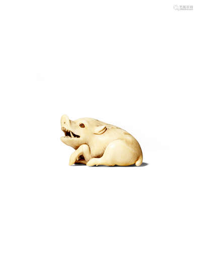 A JAPANESE IVORY NETSUKE OF A RECUMBENT BOAR MEIJI 1868-1912 The beast depicted resting with its