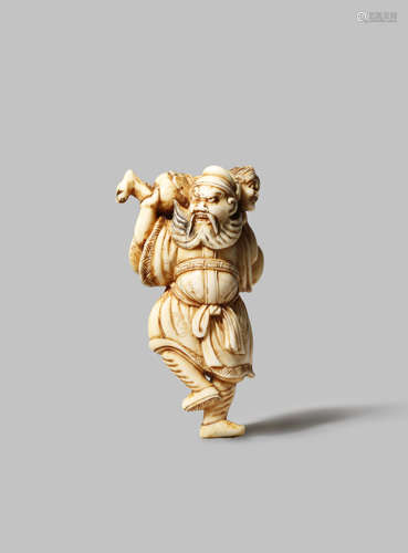 A JAPANESE IVORY NETSUKE EDO 1603-1868 Depicting a tall Shoki and oni, the demon queller with a