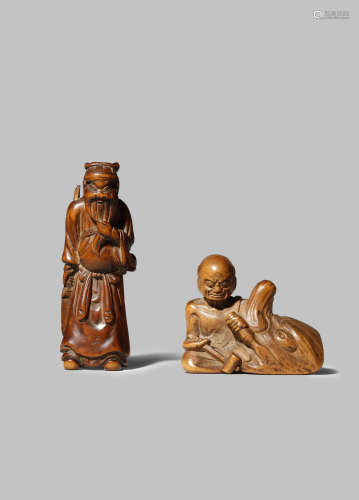 TWO JAPANESE WOOD NETSUKE EDO/MEIJI PERIOD One carved as the Chinese general Kan'u stroking his