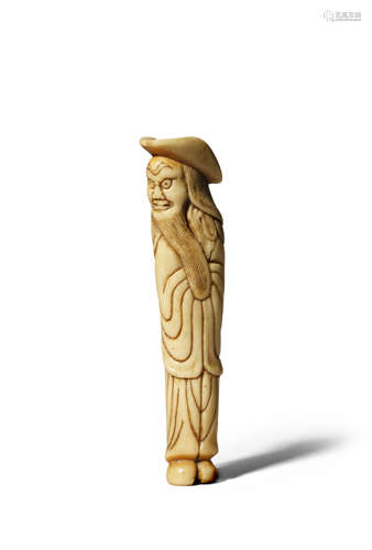 A JAPANESE STAG ANTLER NETSUKE EDO 1603-1868 Depicting a tall foreigner with a large brimmed hat,