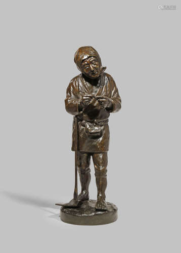 A JAPANESE BRONZE FIGURE OF A LABOURER, OKIMONO MEIJI 1868-1912 The elderly man holding a pipe in