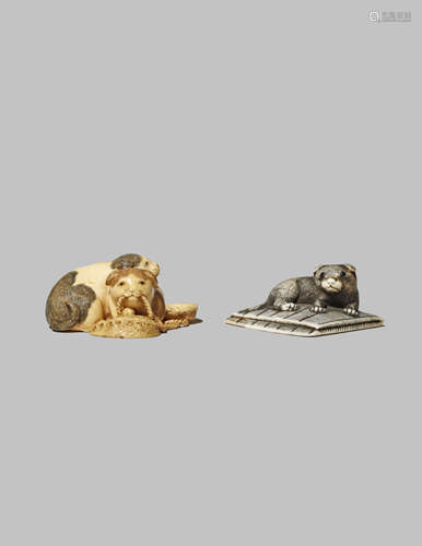 TWO JAPANESE IVORY NETSUKE OF DOGS MEIJI 1868-1912 One with a small chubby puppy lying on a folded