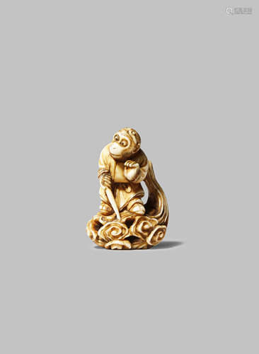 A JAPANESE IVORY NETSUKE OF SON GOKU MEIJI 1868-1912 The Monkey King depicted standing on a platform