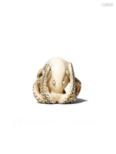 A GOOD JAPANESE IVORY NETSUKE OF AN OCTOPUS EDO/MEIJI PERIOD The mollusk resting with its