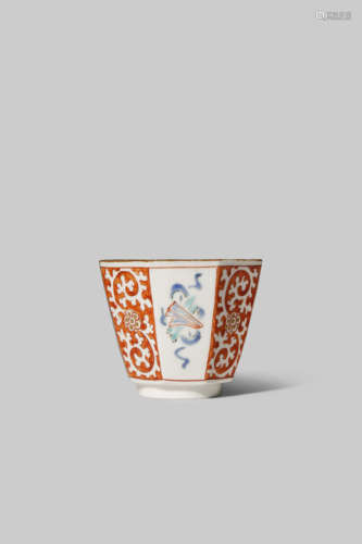 A JAPANESE KAKIEMON OCTAGONAL CUP C.1700 The body decorated in gilt, iron-red, blue, green and black