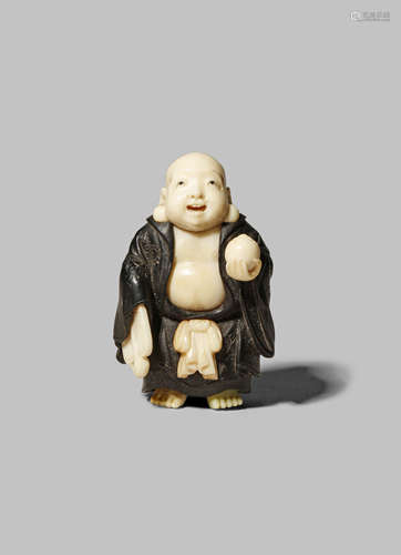 AN UNUSUAL WOOD AND IVORY NETSUKE MEIJI 1868-1912 Depicting Hotei, the God of Contentment and