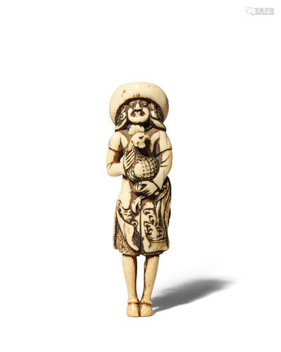 A JAPANESE IVORY NETSUKE EDO 1603-1868 Carved as a tall Dutchman holding a large fighting cock in