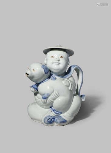 A JAPANESE HIRADO TEAPOT MEIJI 1868-1912 Modelled as a small boy holding a puppy, the dog's mouth