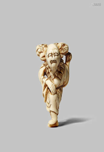 A JAPANESE IVORY NETSUKE EDO 1603-1868 Depicting a tall sennin, the sage standing on one foot and