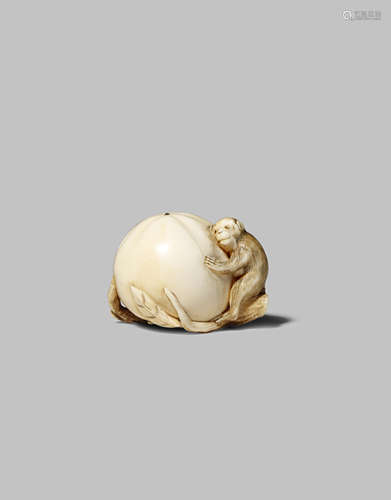 A JAPANESE IVORY NETSUKE MEIJI 1868-1912 Carved as a small monkey hugging a giant persimmon, its