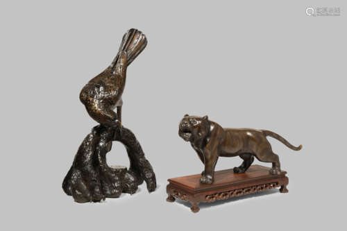 TWO JAPANESE BRONZES, OKIMONO MEIJI 1868-1912 One cast as a tiger standing four-square with its