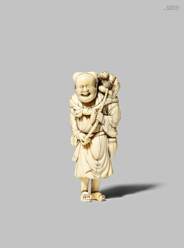 A JAPANESE IVORY NETSUKE OF A SARUMAWASHI EDO 1603-1868 The tall monkey trainer depicted standing