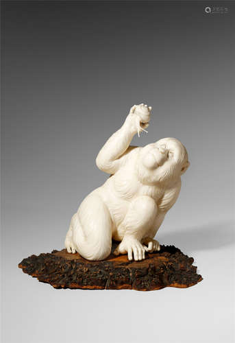 A GOOD JAPANESE IVORY CARVING, OKIMONO MEIJI 1868-1912 Finely carved as a monkey gently holding a