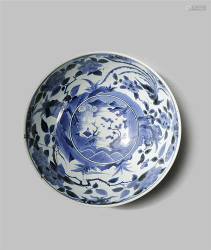 A JAPANESE BLUE AND WHITE ARITA BOWL C.1700 The well decorated with a mountainous river landscape,