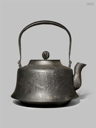 A MASSIVE JAPANESE IRON KETTLE, TETSUBIN 19TH/20TH CENTURY The squat body with a rough ishime