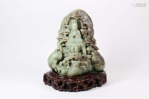 A Chinese Carved Jade Decoration with Wood Base