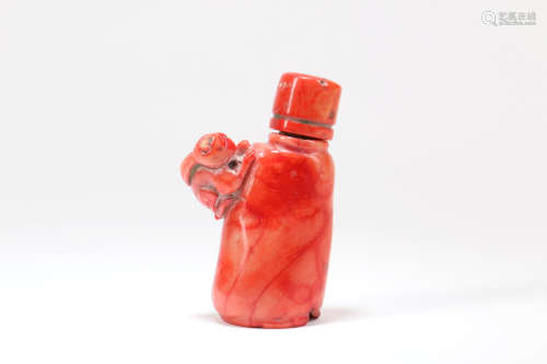 A Chinese Carved Coral Snuff Bottle