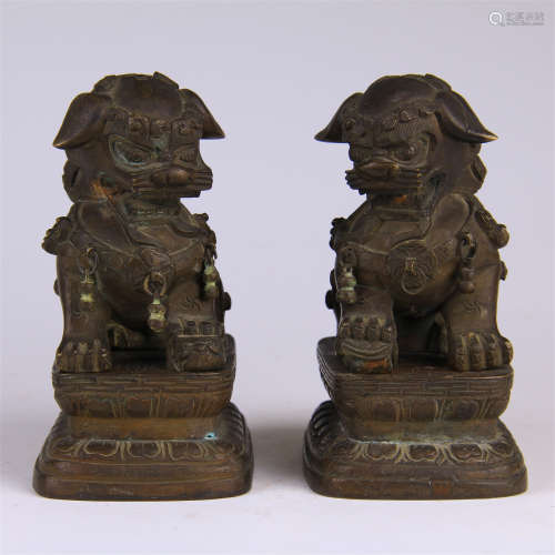 PAIR OF CHINESE BRONZE SEATED LIONS