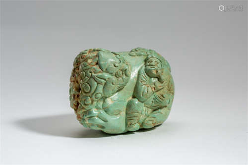 CHINESE TURQUOISE CARVED MAN WITH FOO DOG