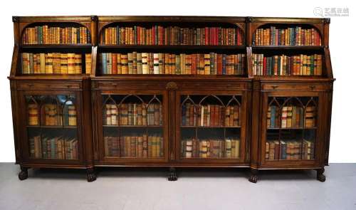 LARGE REGENCY PERIOD ROSEWOOD AND BRASS INLAID GOTHIC LIBRARY BOOKCASE, IN THE MANNER OF THOMAS HOPE, CIRCA 1820