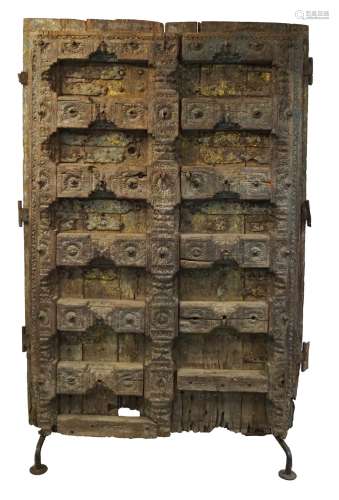 PAIR OF LARGE 18TH CENTURY INDIAN CARVED PANELLED AND METAL BOUND ENTRANCE DOORS