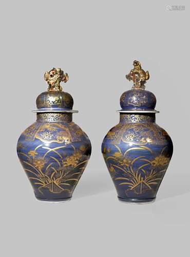 A PAIR OF JAPANESE ARITA BALUSTER VASES AND COVERS C.1700 The ovoid bodies decorated in gilt with