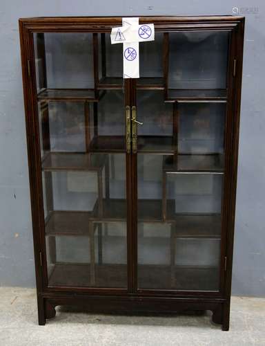 Chinese hardwood glazed cabinet with twelve compartments on shaped supports, 108cm x 69cm x 25cm,