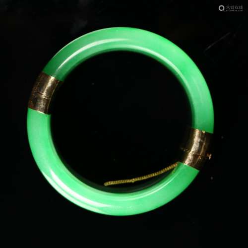 A Chinese Green Jadeite Bangle