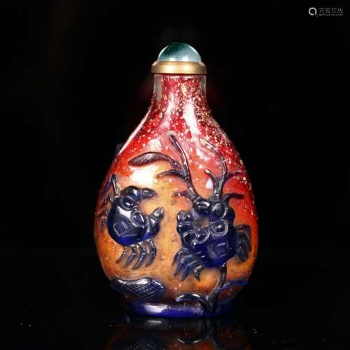 A Carved Peking Glass Snuff Bottle