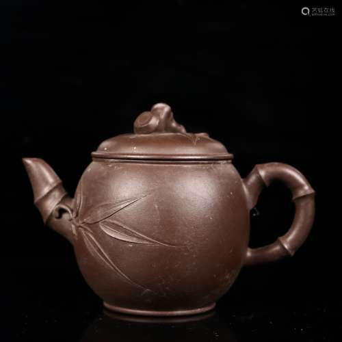 A Chinese varved Yixing tea pot.