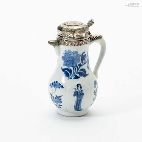 A Chinese blue and white ewer with silver cover